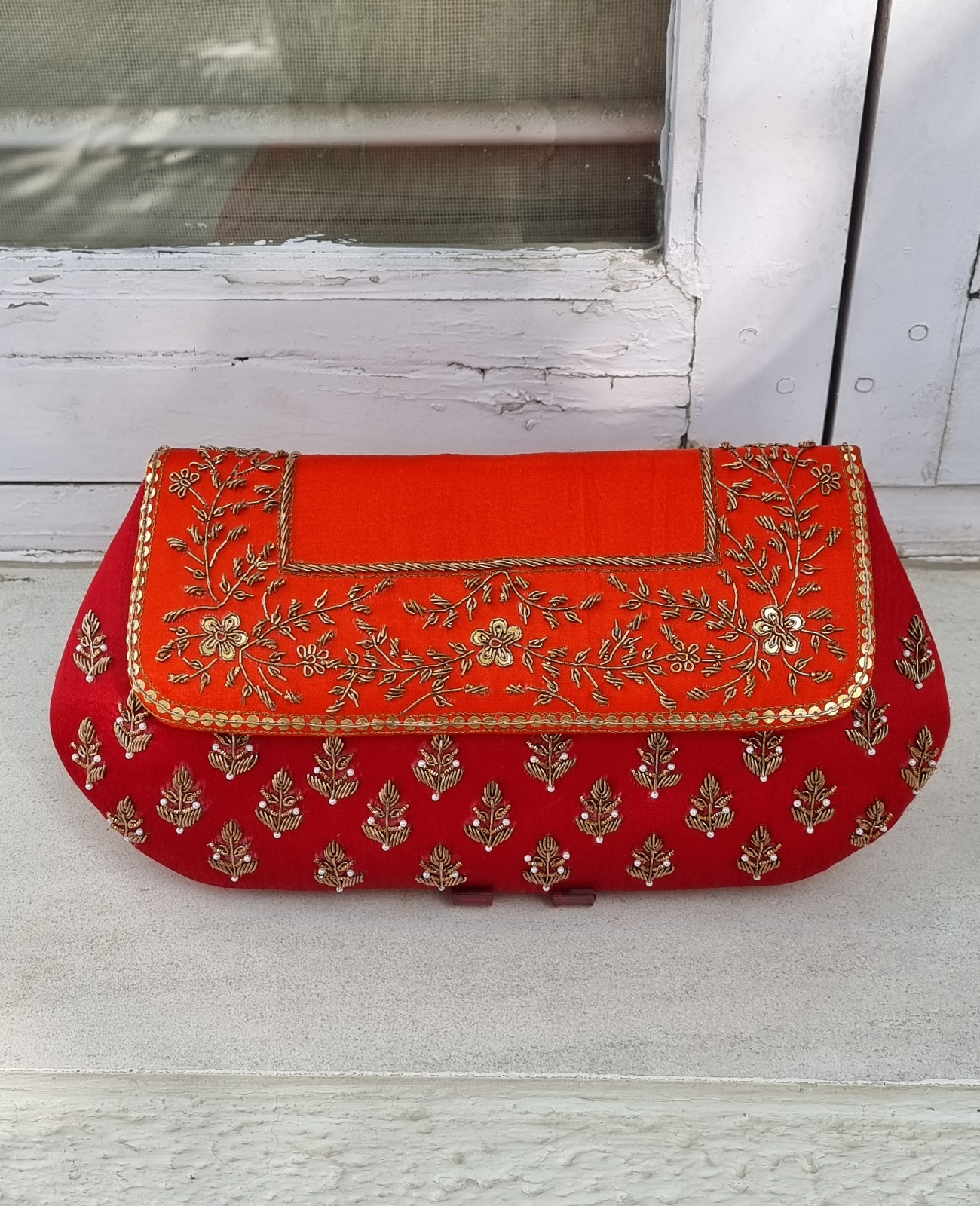 Orange red sales clutch bag